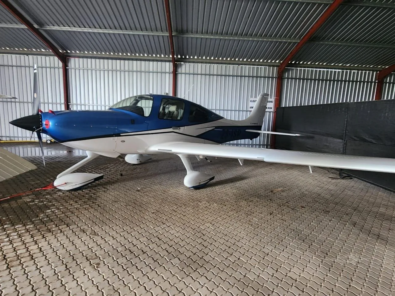 Exterior view of a 2017 CIRRUS SR22-G6, ZS-ISP.