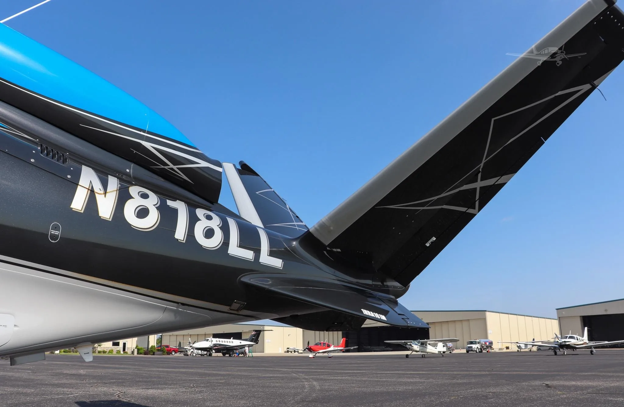 Exterior view of a 2021 CIRRUS VISION SF50-G2+, N818LL.