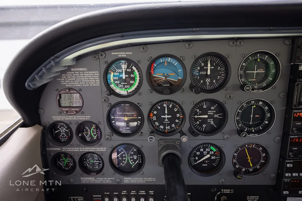 Cockpit and instrument panel of a 1999 Cessna 206H Stationair.