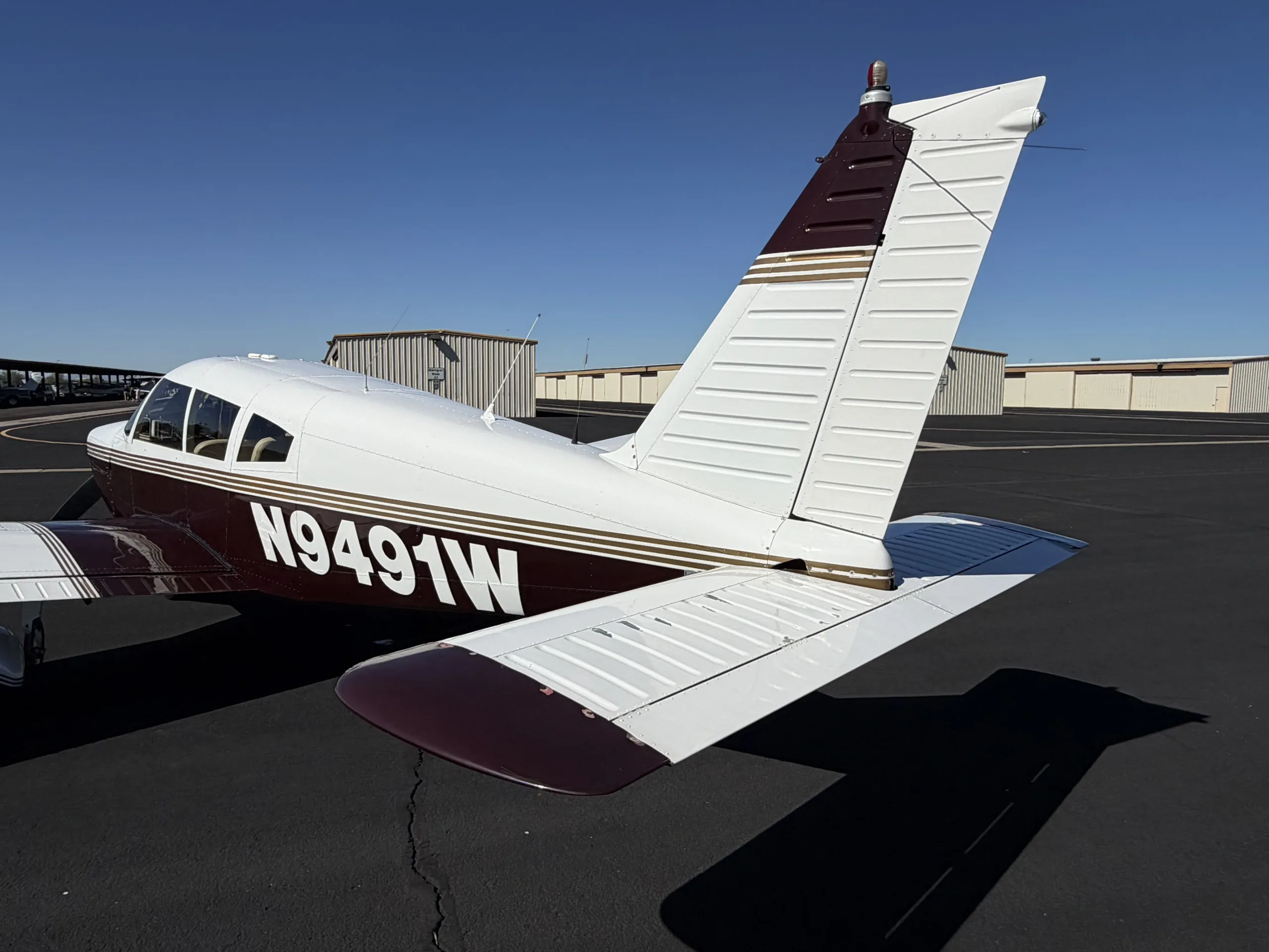 Exterior view of a 1969 Piper Cherokee, N9491W.