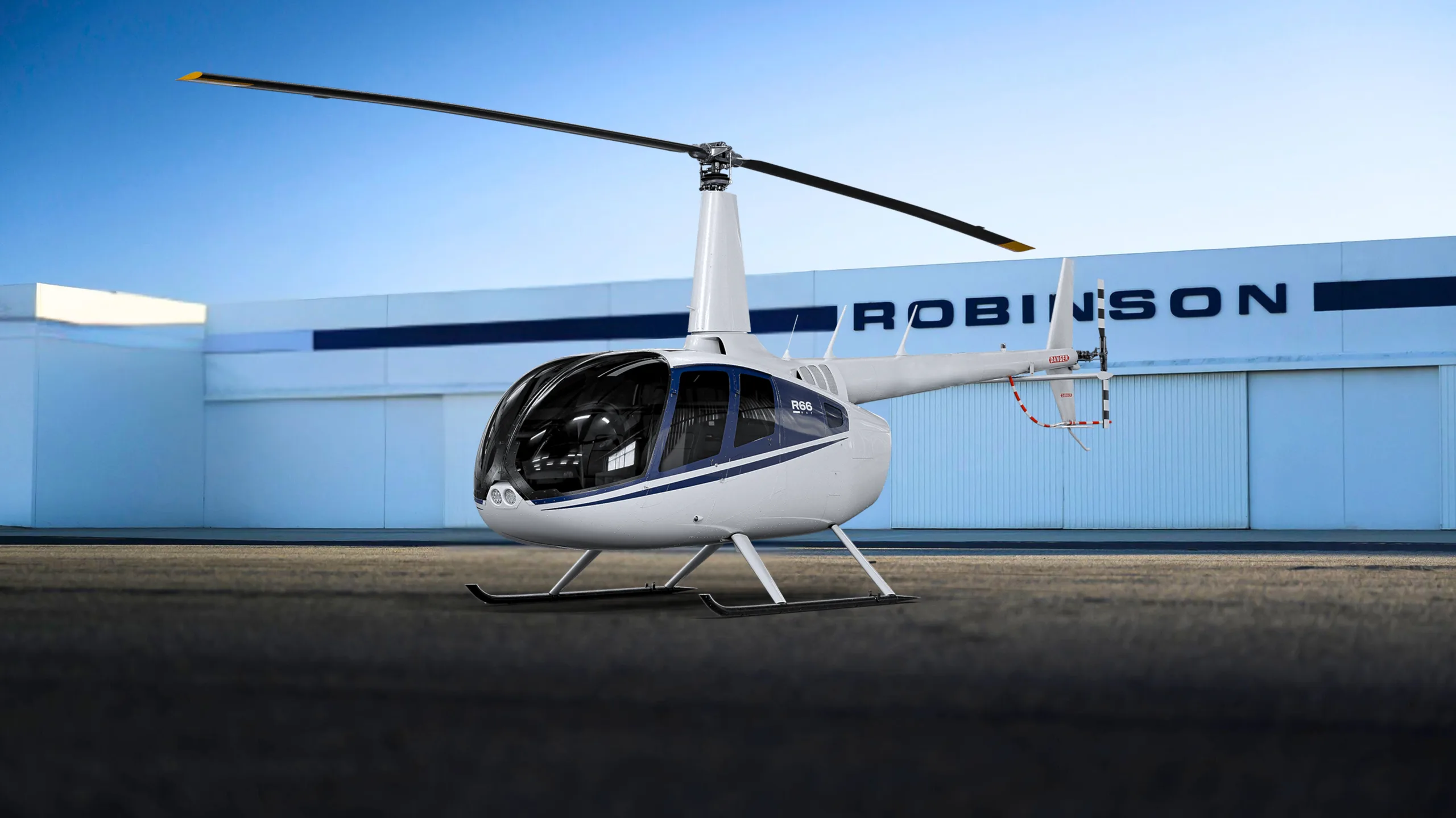 Marketing image of a 2025 Robinson R44 Clipper II - with pop out floats.