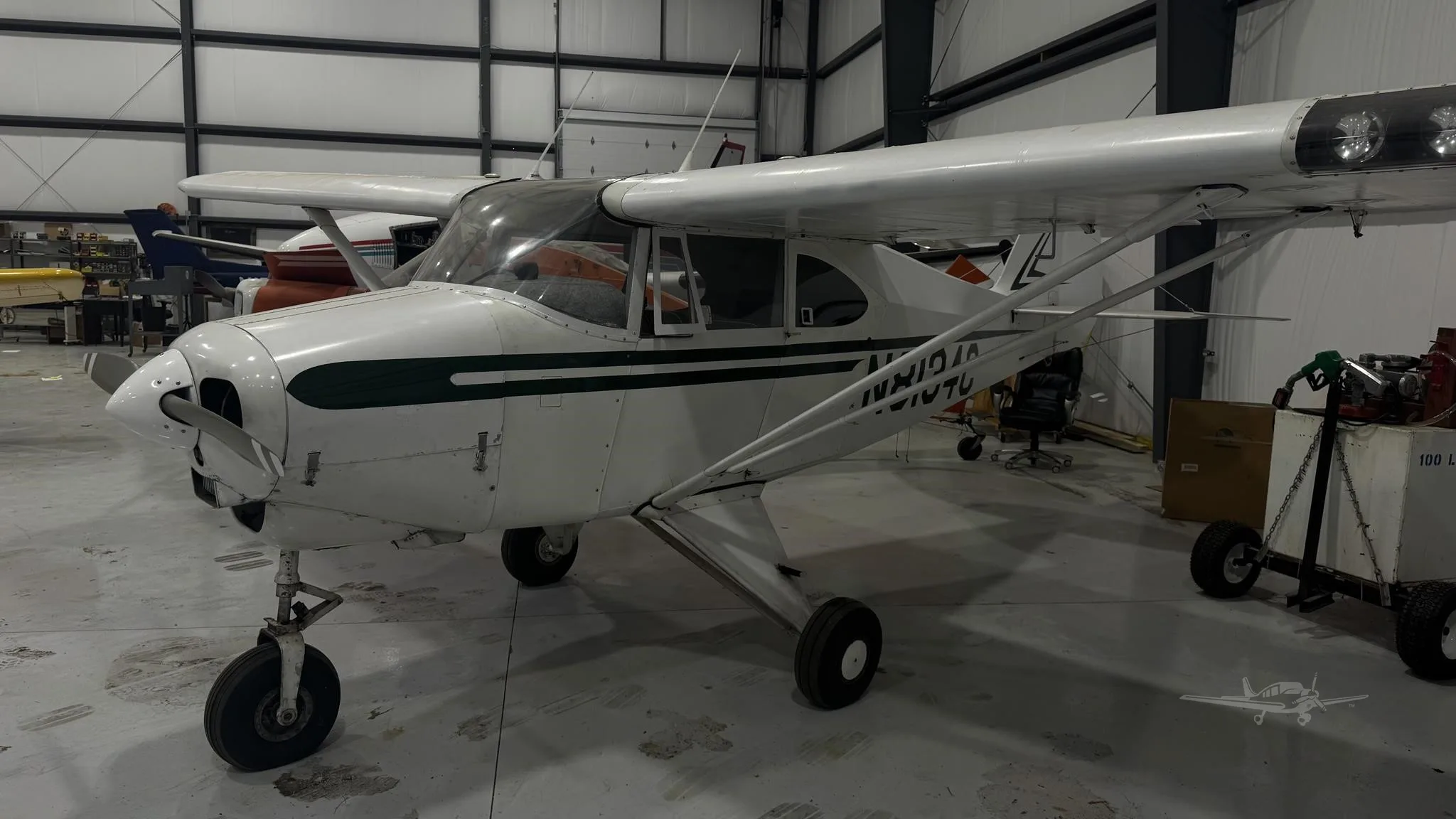 Exterior view of a 1954 PIPER TRI-PACER, N8143C.