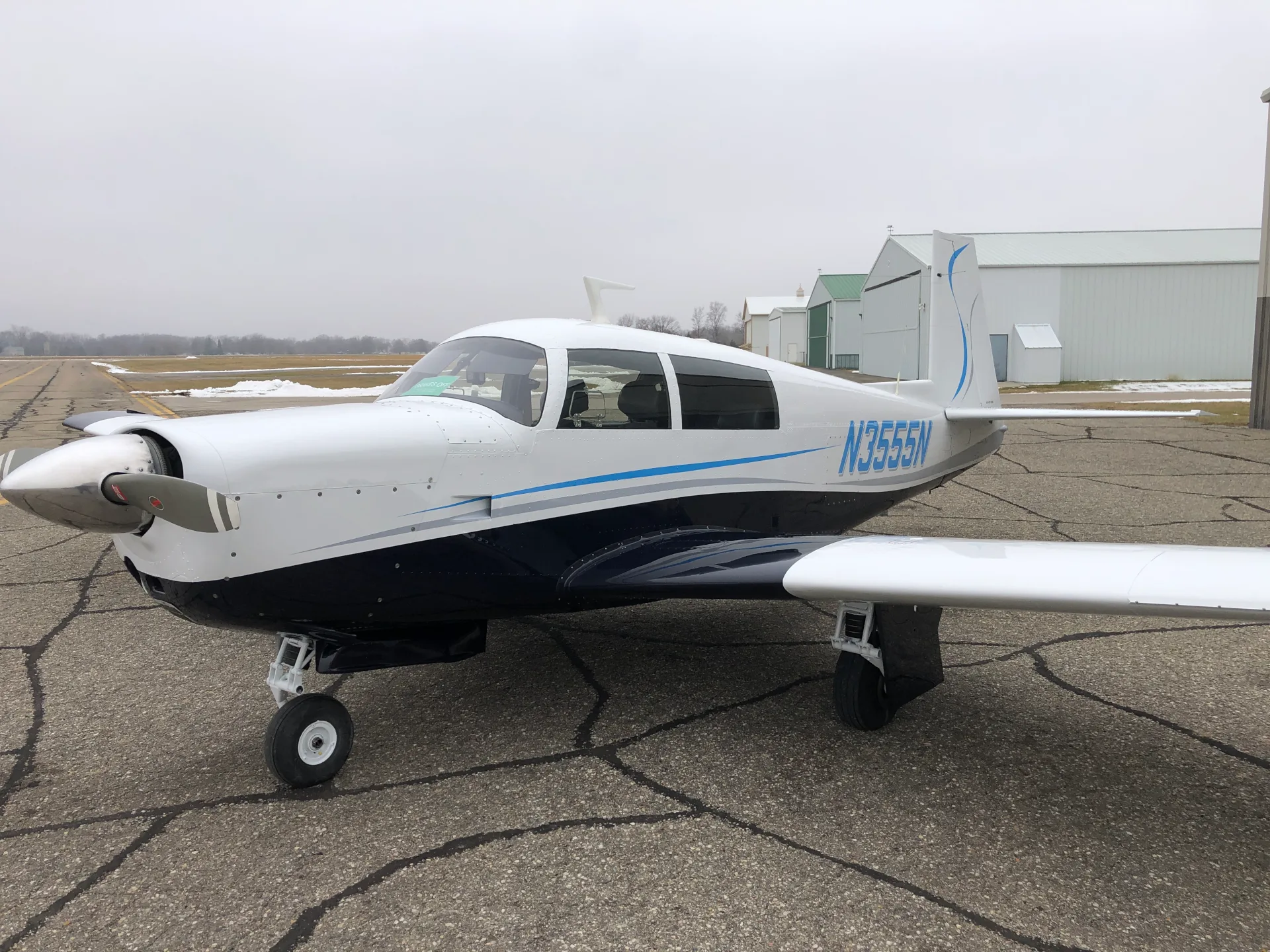 Exterior view of a 1967 Mooney M20F - Elite Air Service.