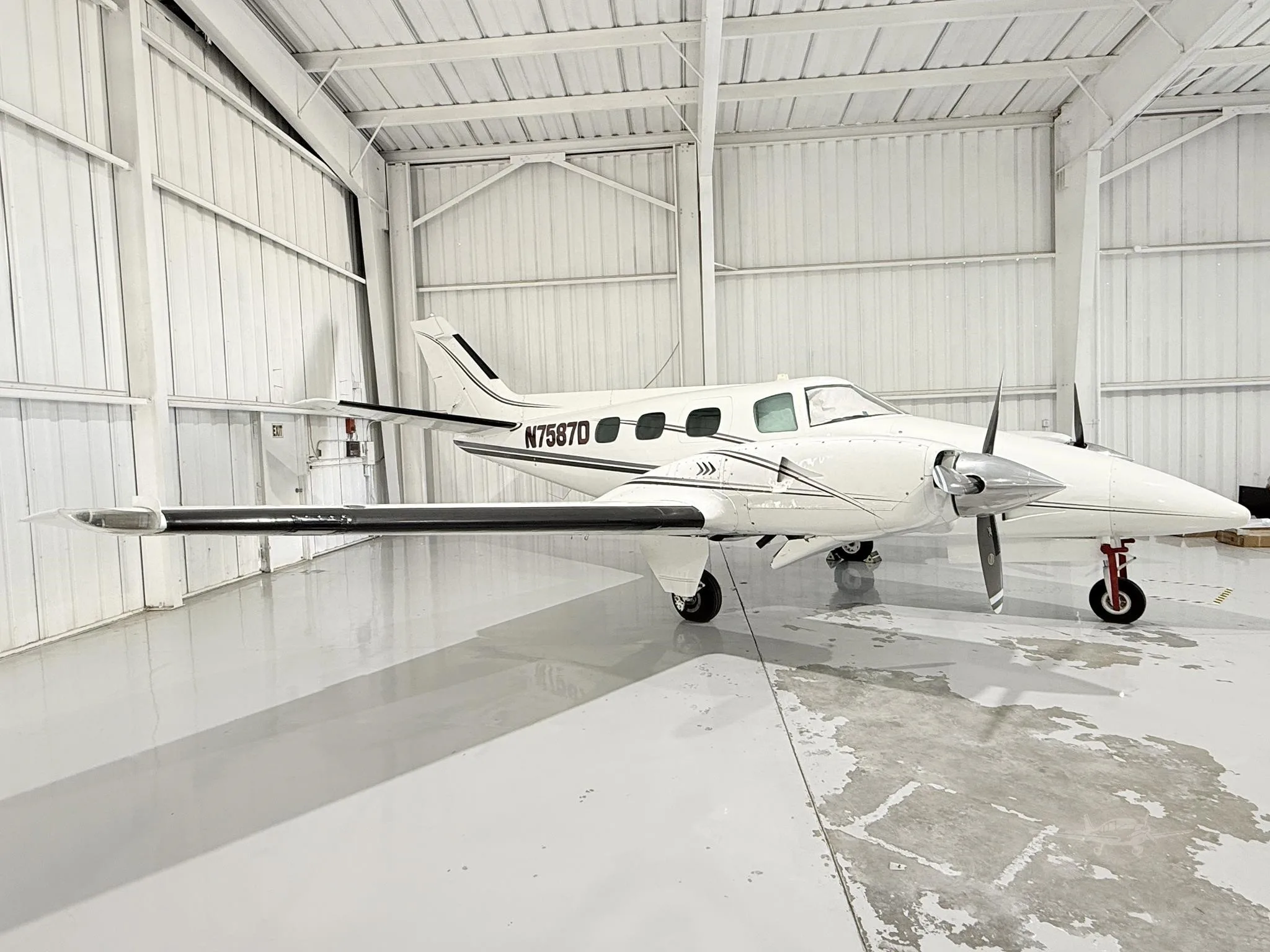 Exterior view of a 1971 BEECHCRAFT A60 DUKE, N7587D.