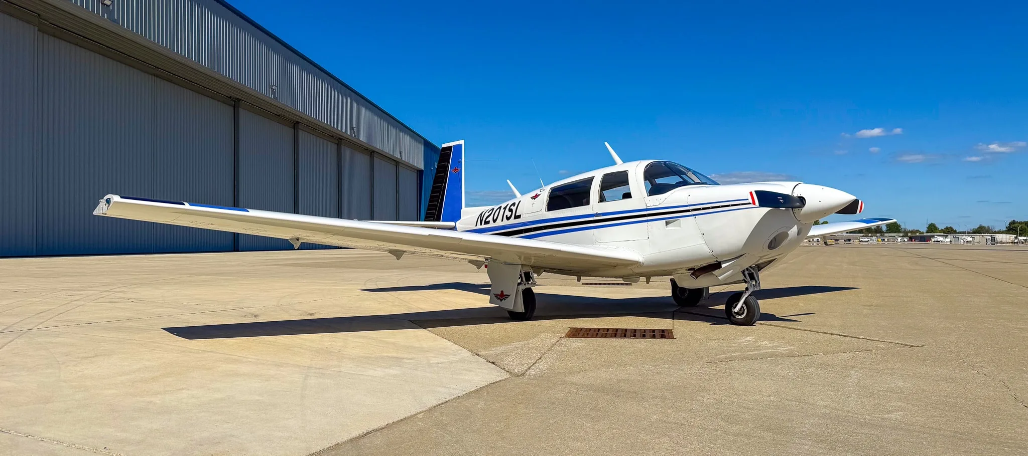 Exterior view of a 1977 Mooney M20J, N201SL.