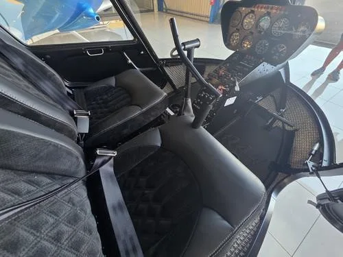 Cockpit and instrument panel of a 2007 ROBINSON R44 RAVEN II.
