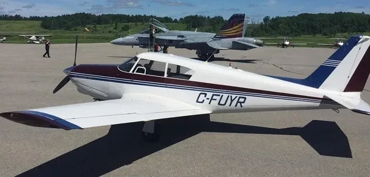 Exterior view of a 1964 Piper Comanche.