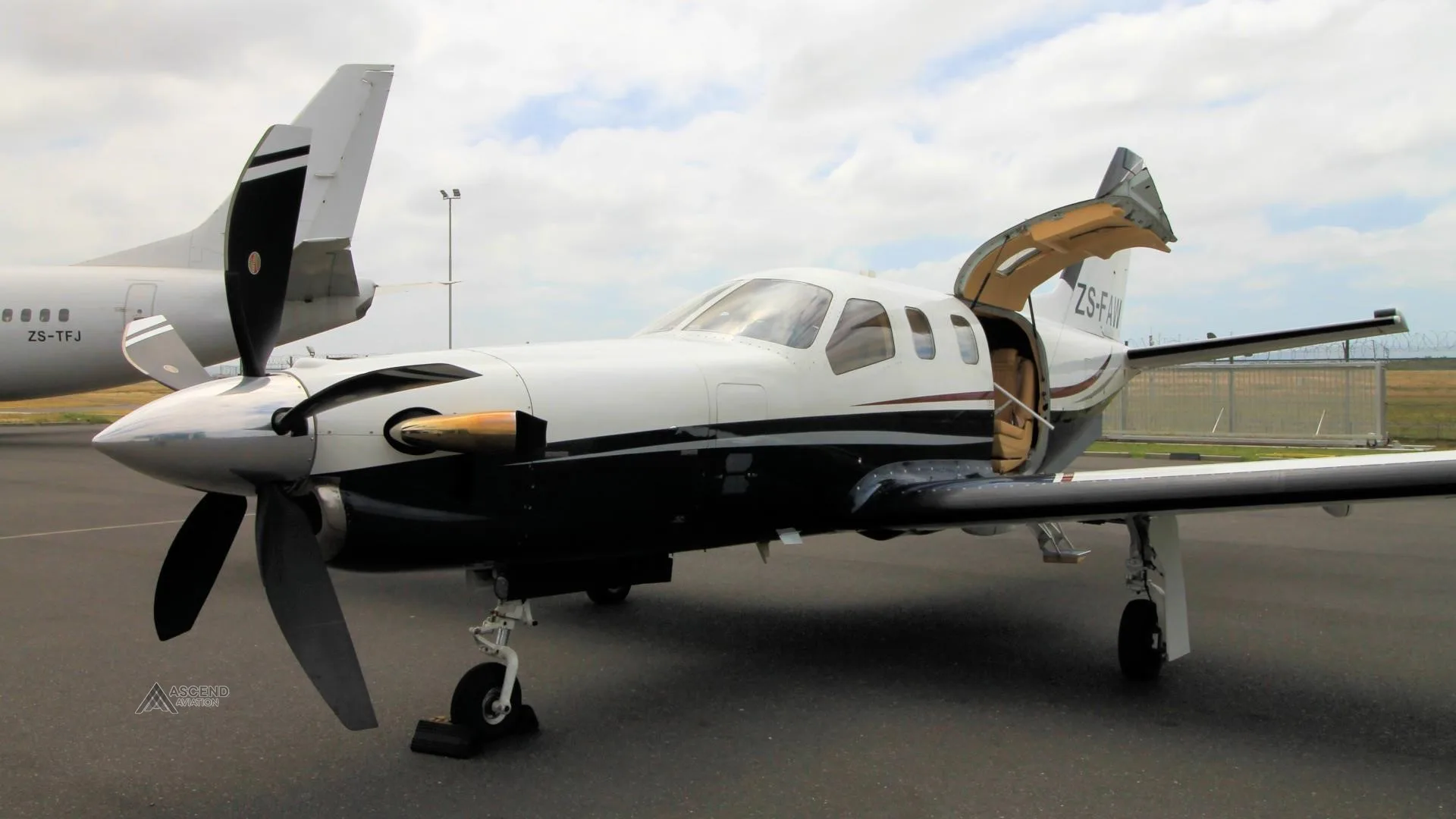 Exterior view of a 2006 DAHER TBM 700C2, ZS-FAW.