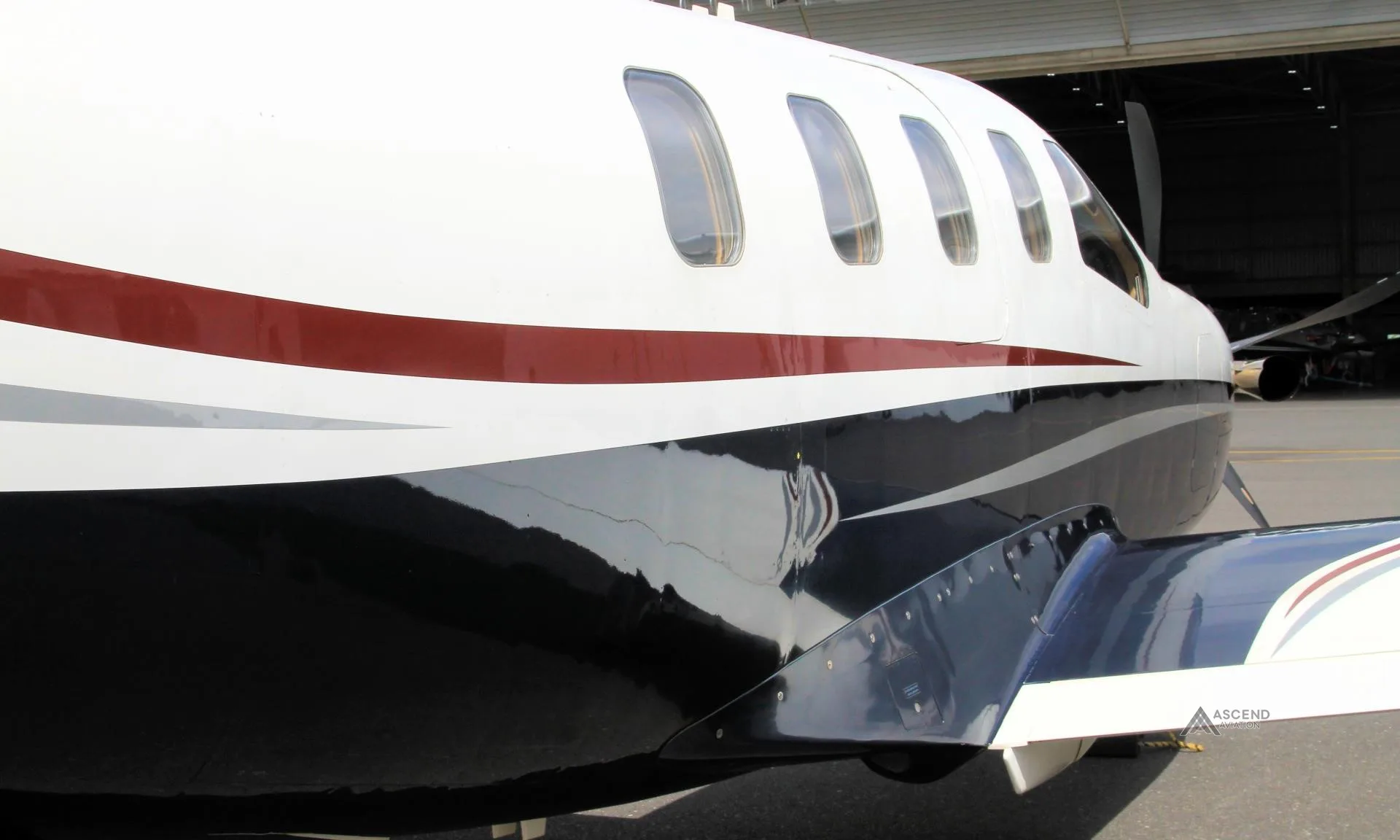 Exterior view of a 2006 DAHER TBM 700C2, ZS-FAW.
