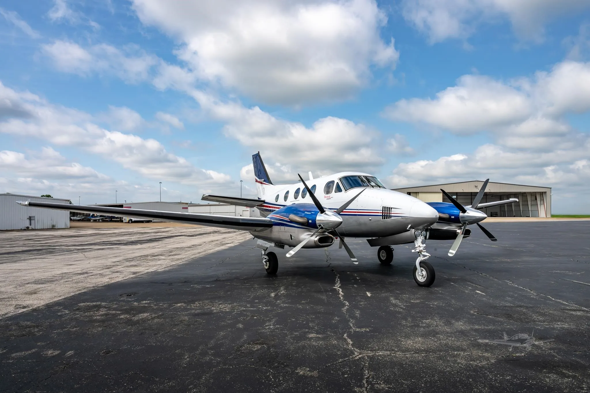 Exterior view of a 2009 BEECHCRAFT KING AIR C90GTI, N6211J.