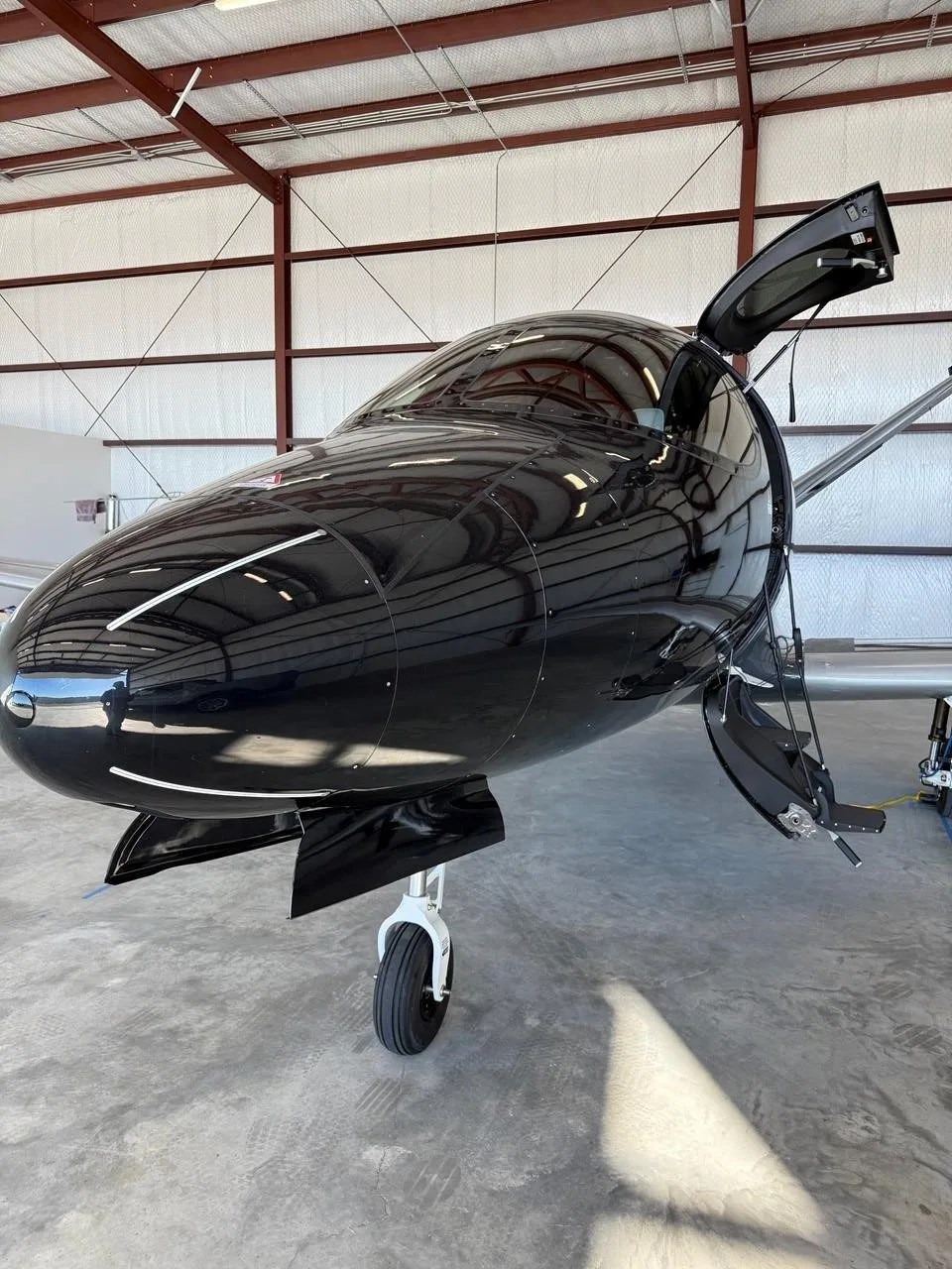 Exterior view of a 2023 CIRRUS VISION SF50-G2+, N112CK.