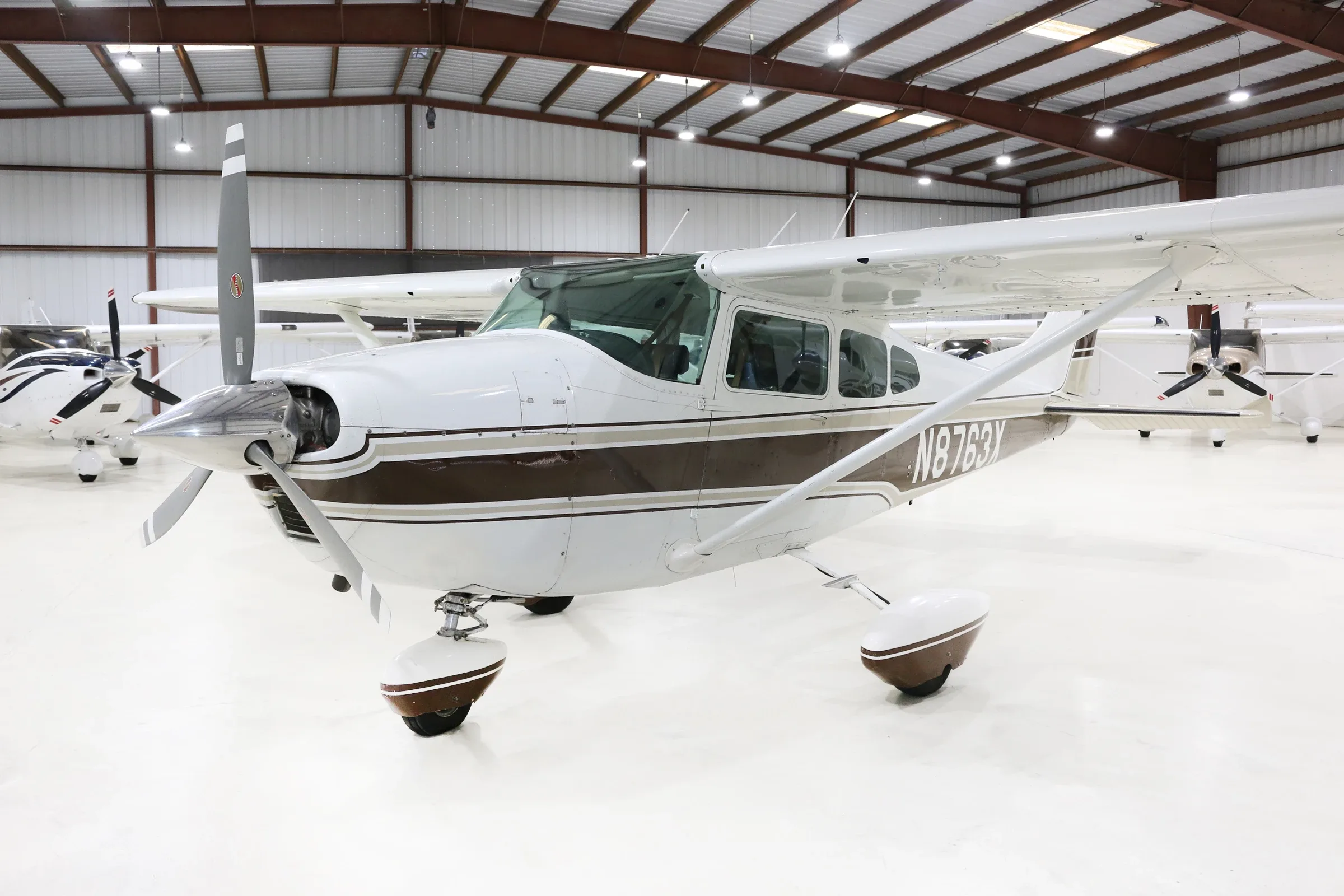 Exterior view of a 1961 Cessna 182D, N8763X.
