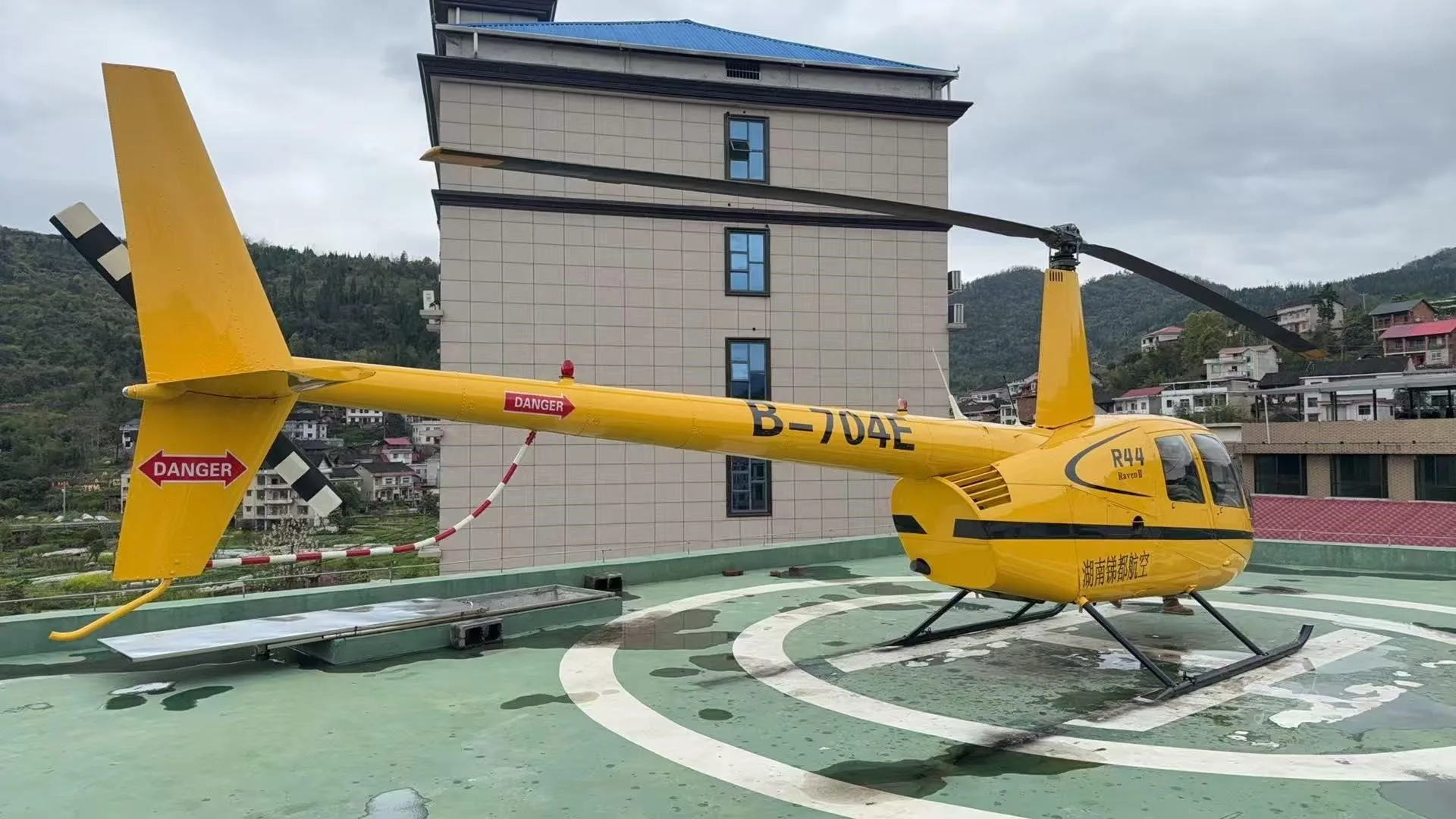 Exterior view of a 2003 ROBINSON R44 RAVEN II.