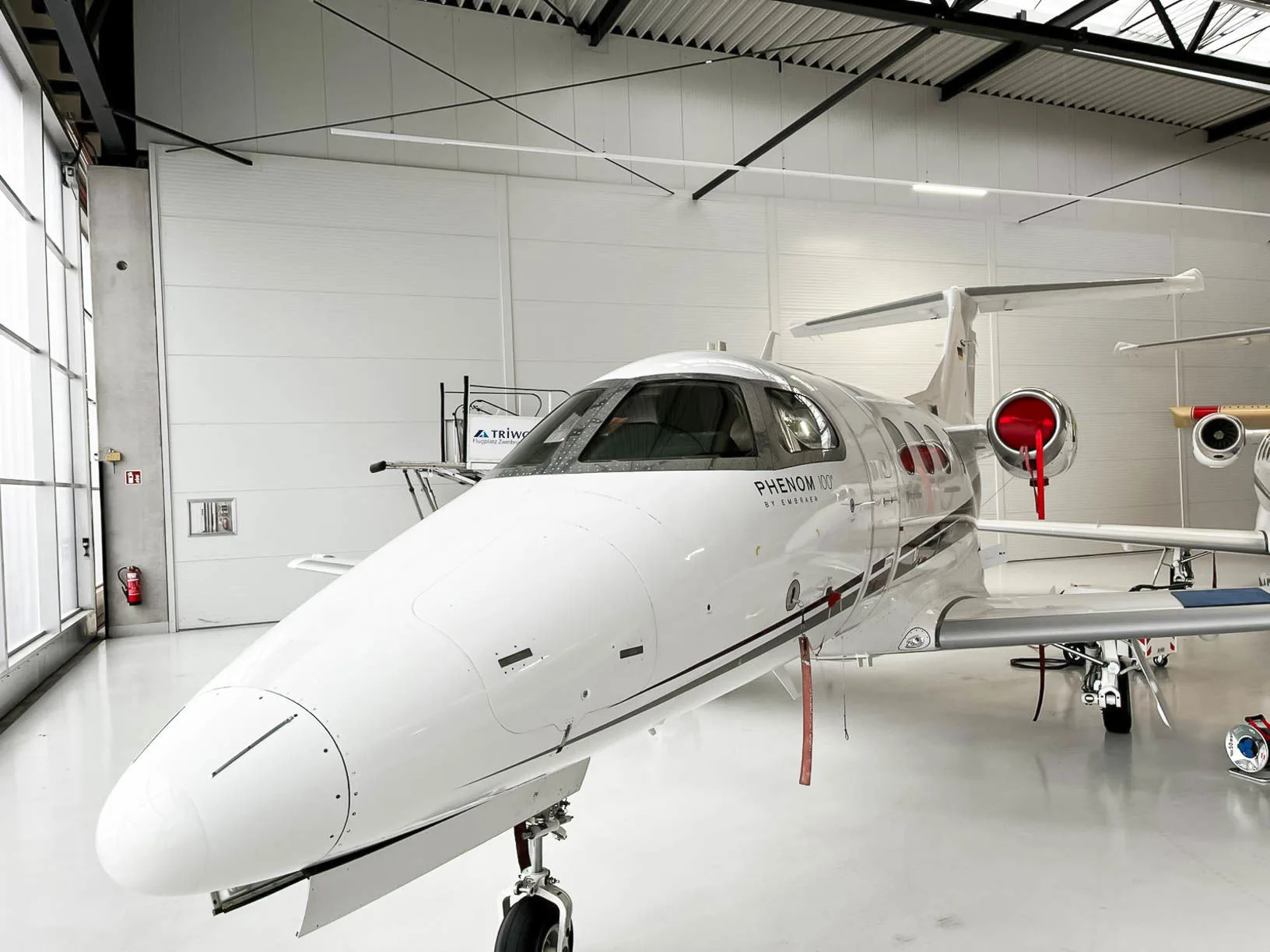 Exterior view of a 2010 Embraer Phenom 100, D-IAAB.