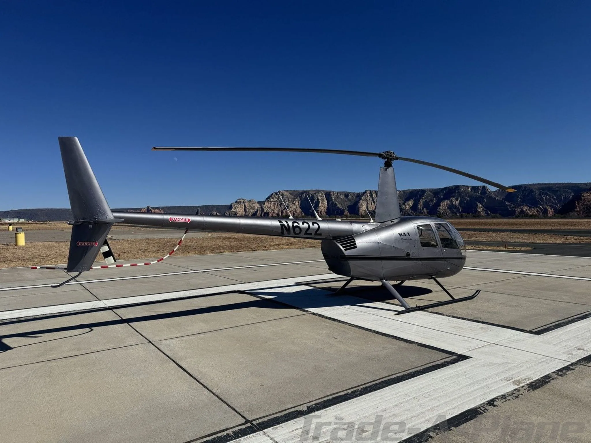 Marketing image of a 2002 ROBINSON R44 RAVEN II.
