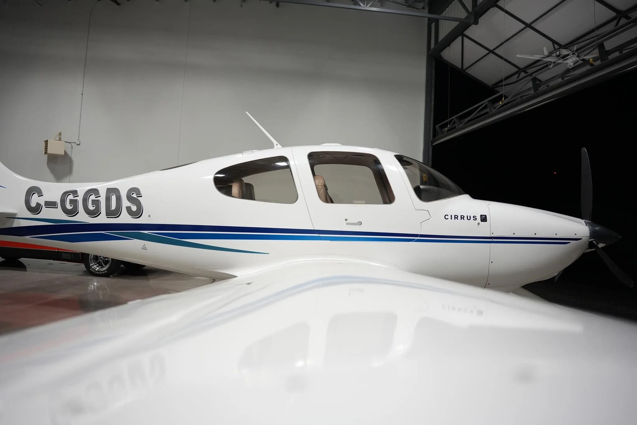 Exterior view of a 2003 CIRRUS SR20, C-GGDS.