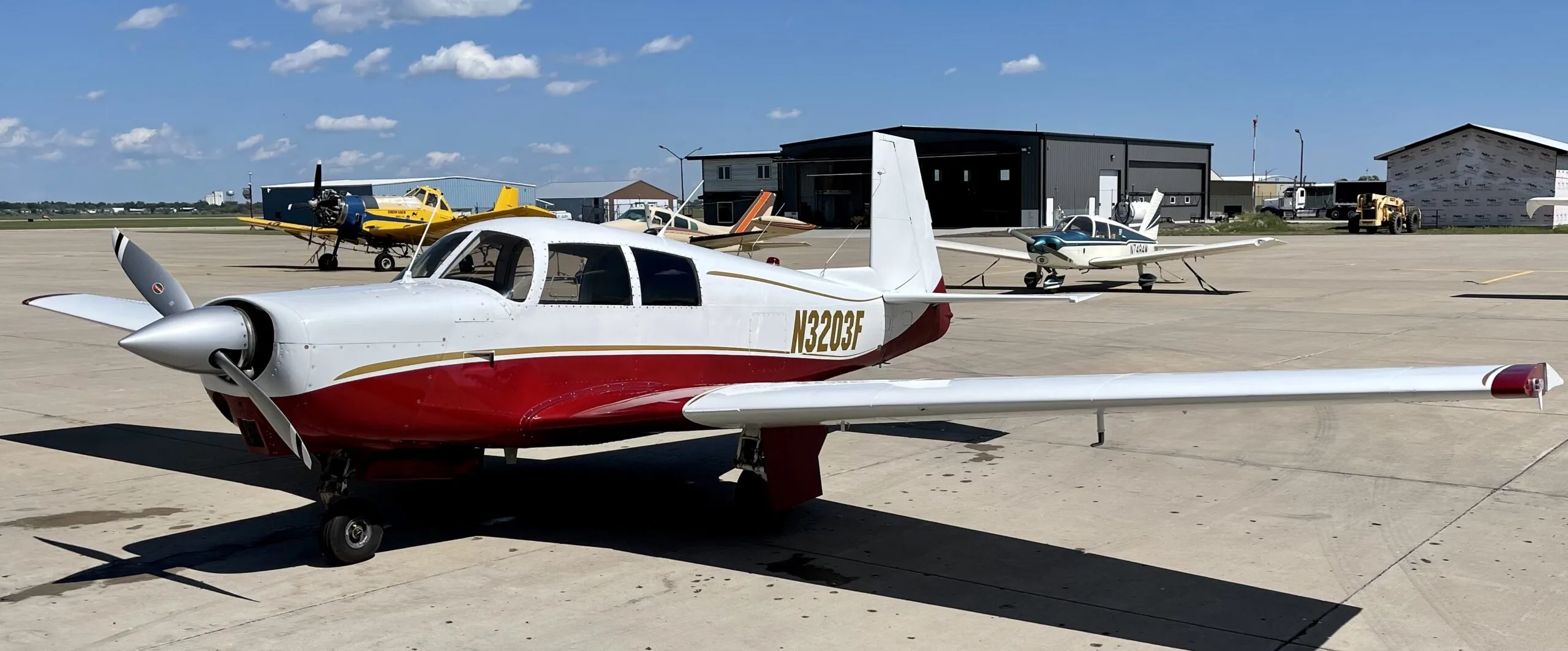 Exterior view of a 1967 Mooney M20C, N3203F.