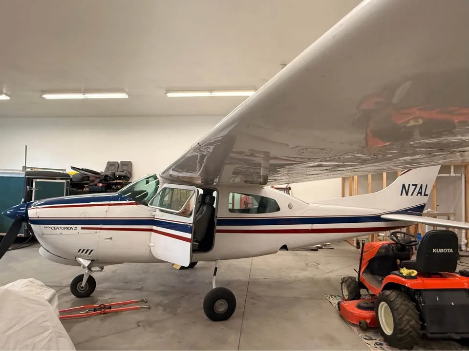 Exterior view of a 1979 Cessna 210N, N7AL.