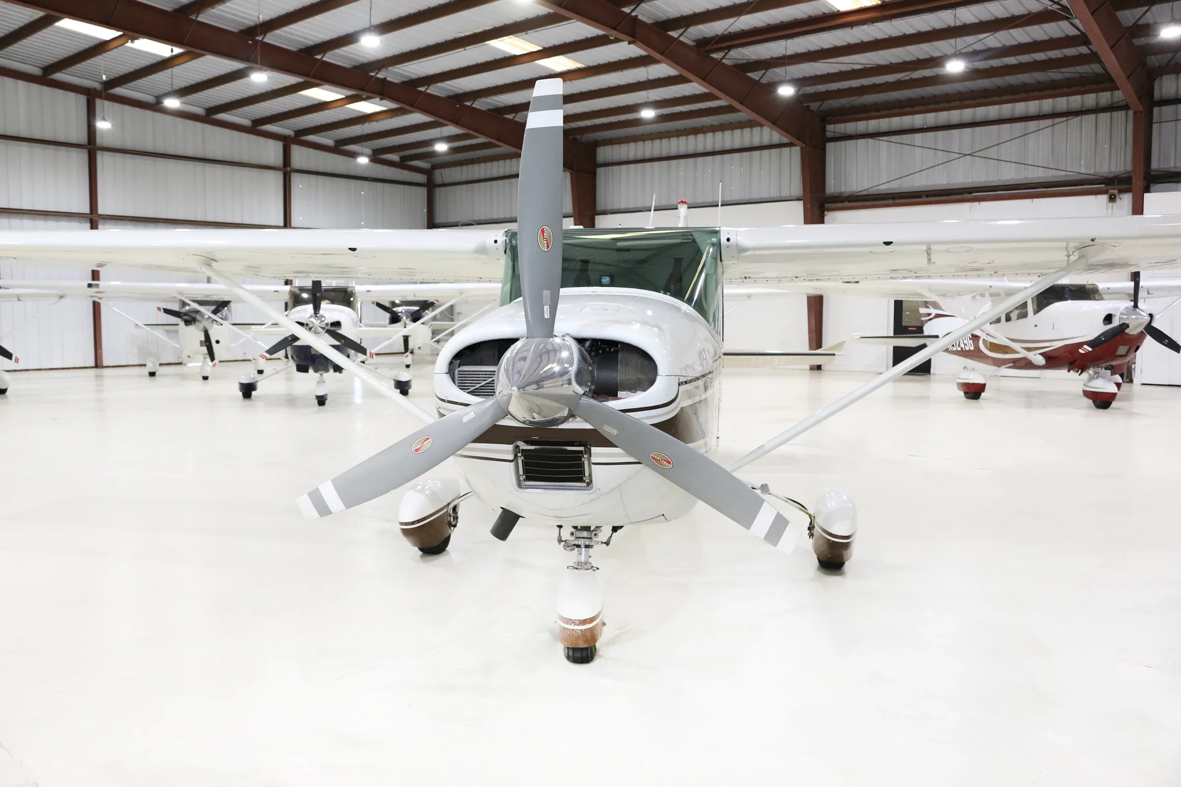 Exterior view of a 1961 Cessna 182D, N8763X.