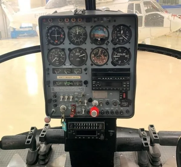 Cockpit and instrument panel of a 2006 SCHWEIZER 269C-1.