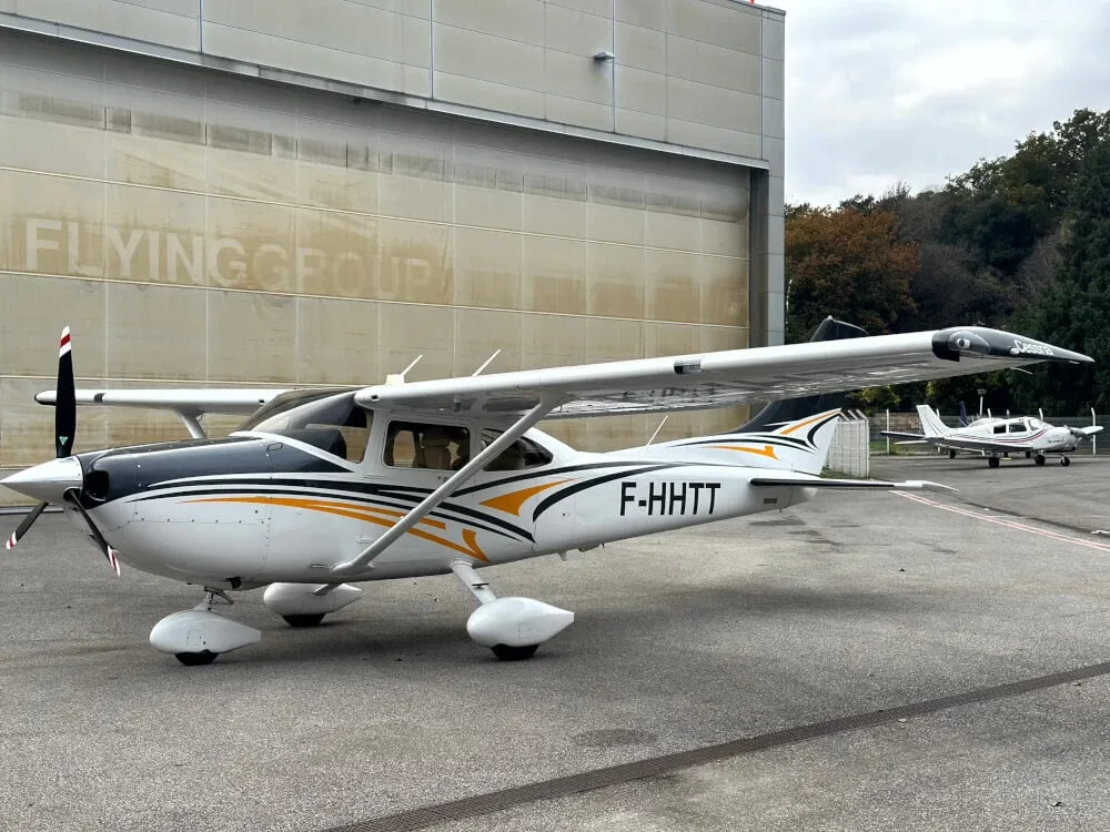 Exterior view of a Cessna Piston 180, N9206C.