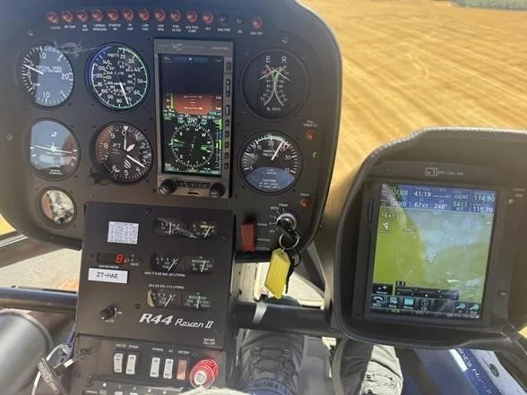 Cockpit and instrument panel of a 2017 ROBINSON R44 RAVEN II.