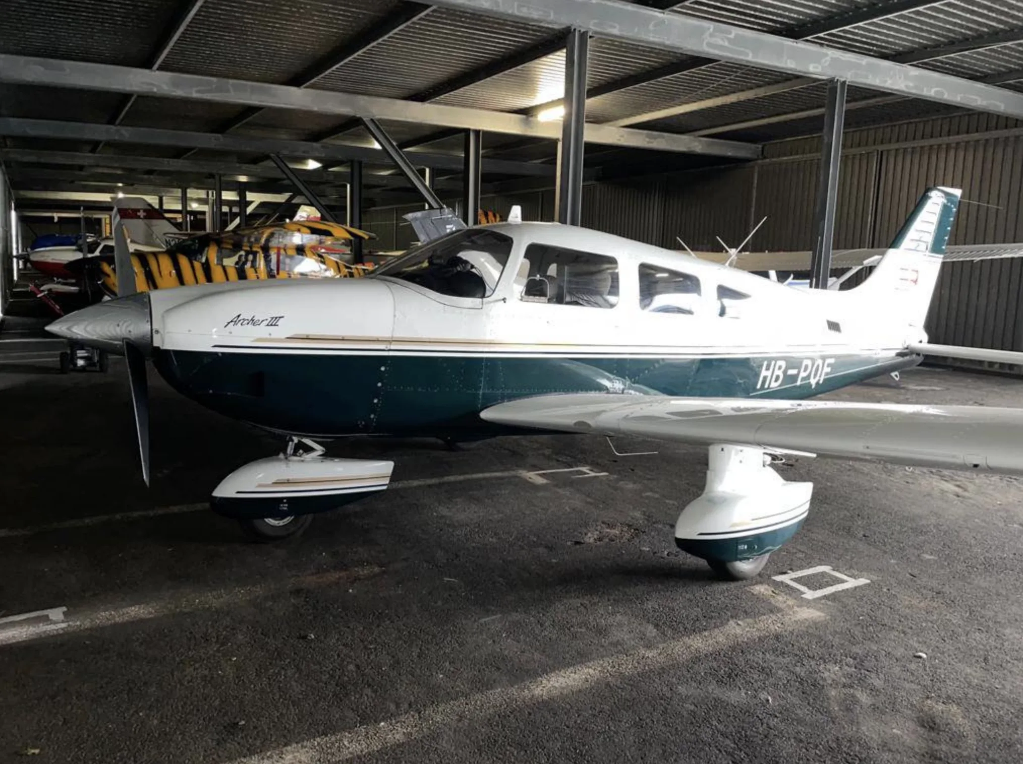 Exterior view of a Piper Piston, HB-PQF.