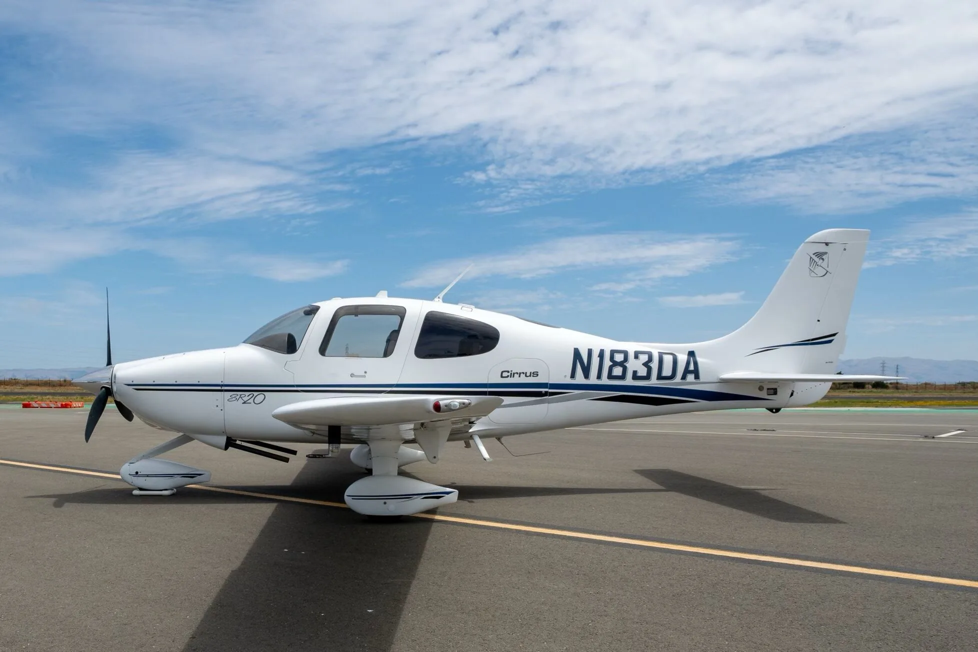 Exterior view of a 2003 Cirrus SR20-G1, N183DA.