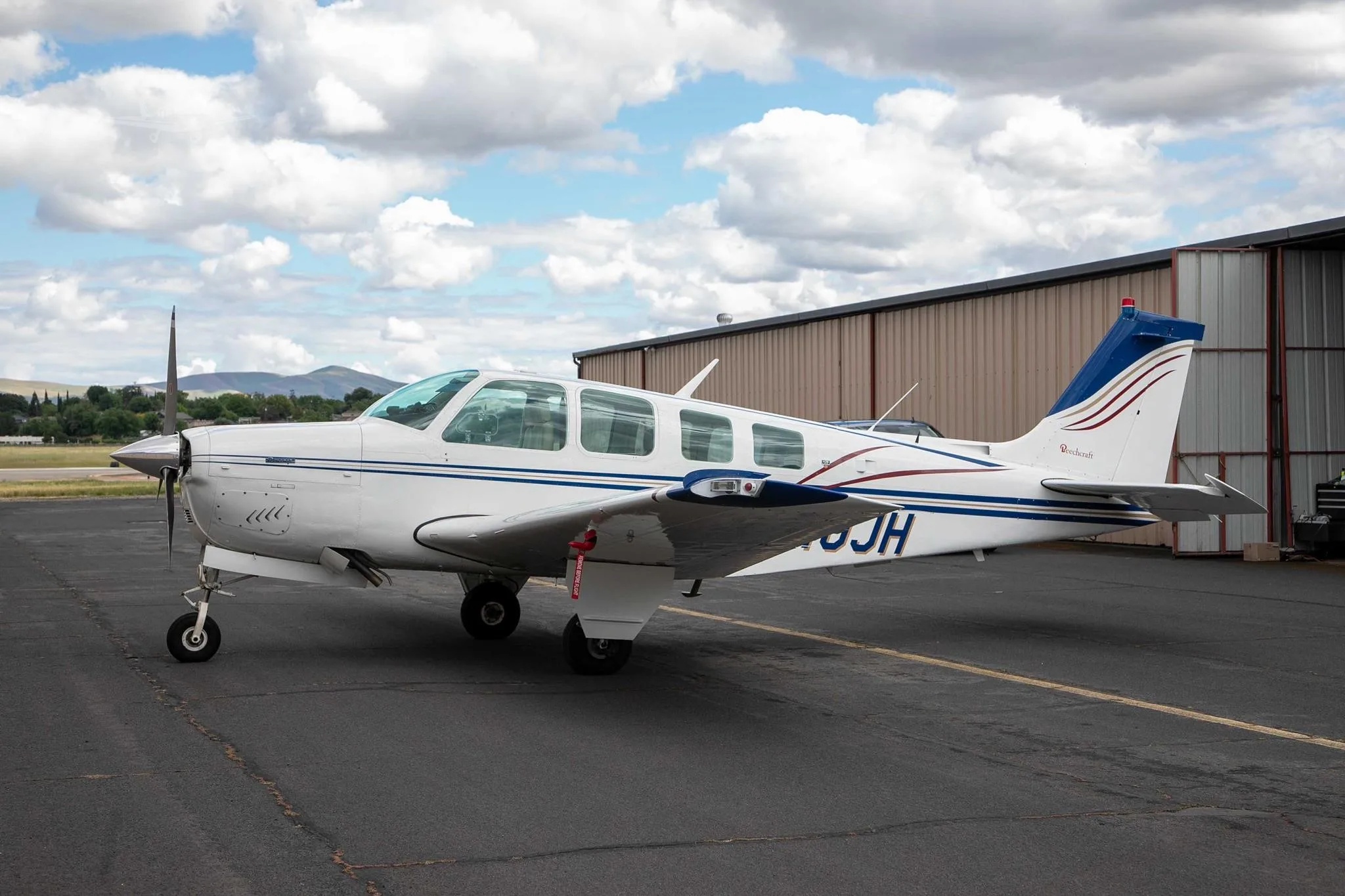 Exterior view of a 1976 BEECHCRAFT A36 BONANZA, N40JH.
